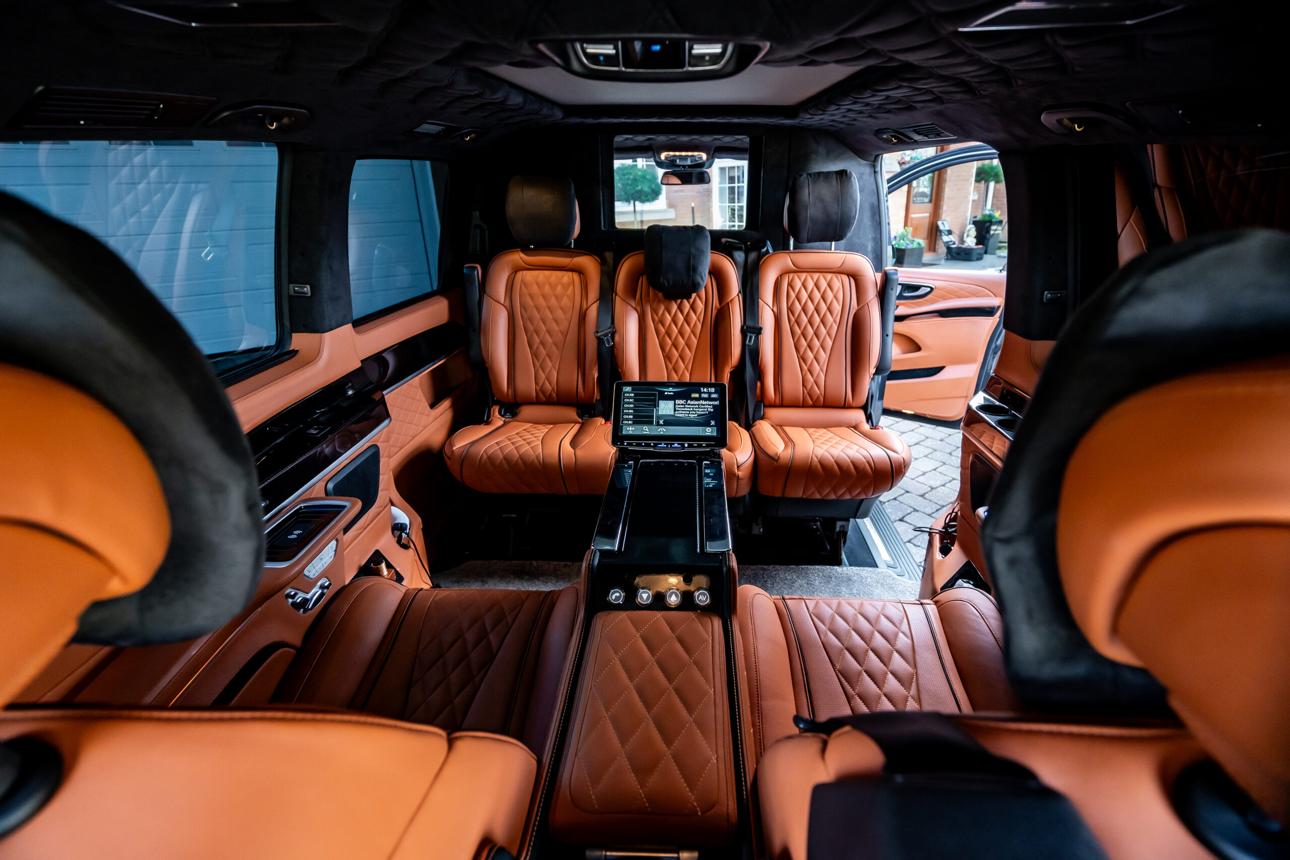 Showing the backseat of a luxury vehicle