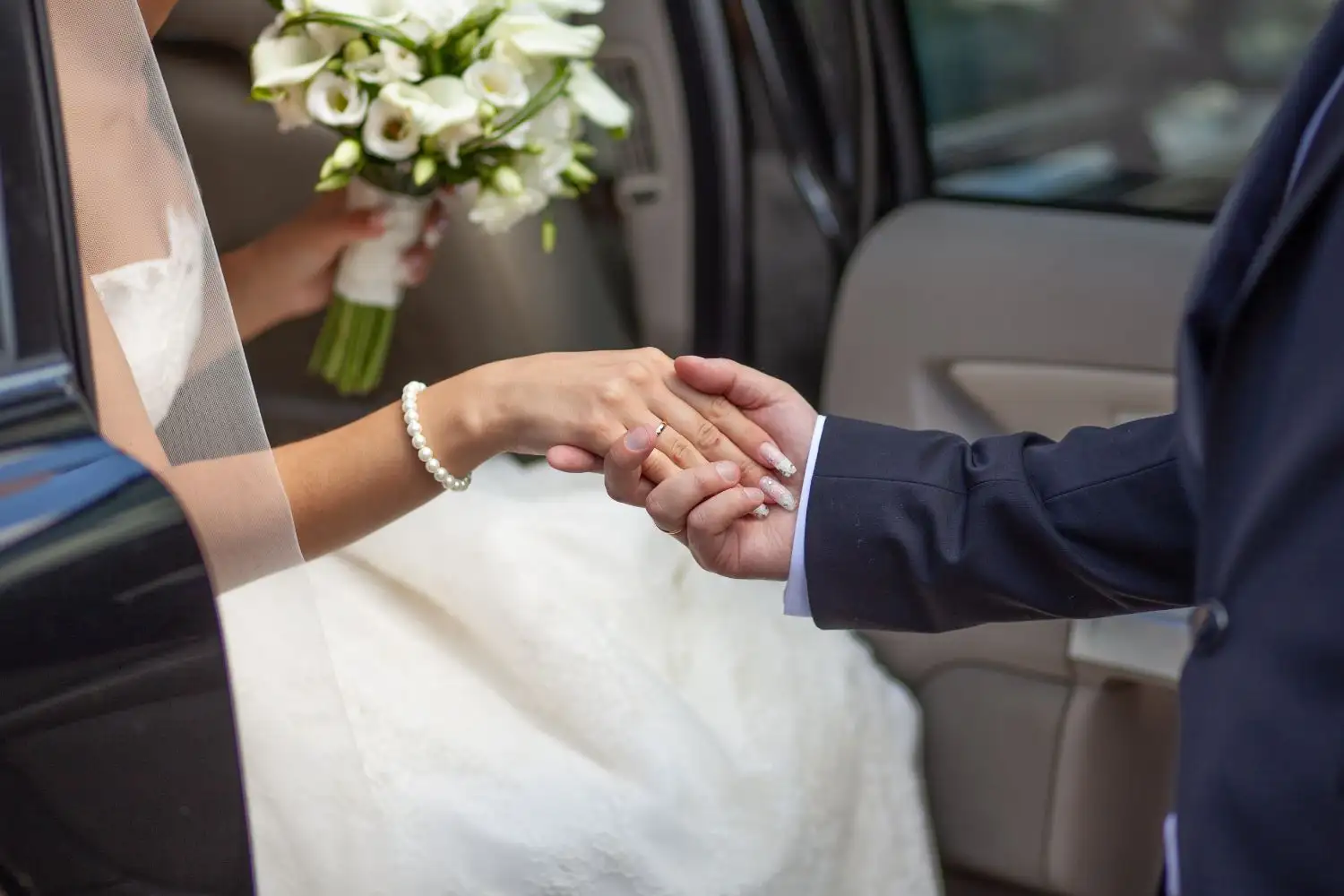 Bride getting out of a car